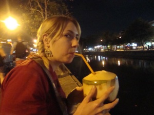 Drinking a coconut by the canal.